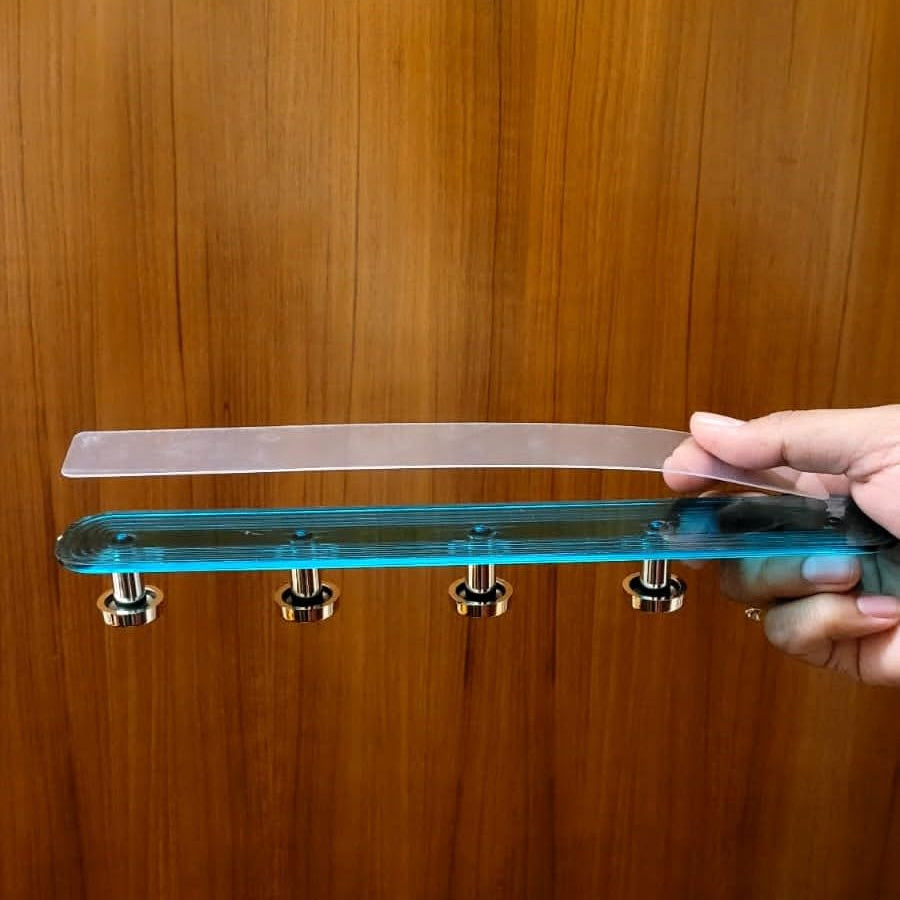 A Person is Holding Adhesive Wall Hooks.