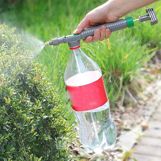 A Person is Watering Plants Using Adjustable High Pressure Sprayer.