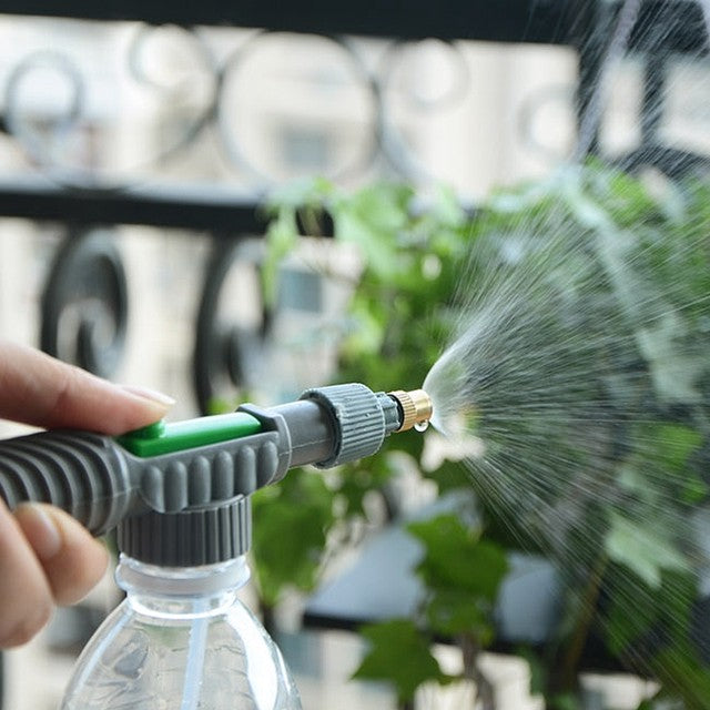 A Person is Watering Plants Using Adjustable High Pressure Sprayer.