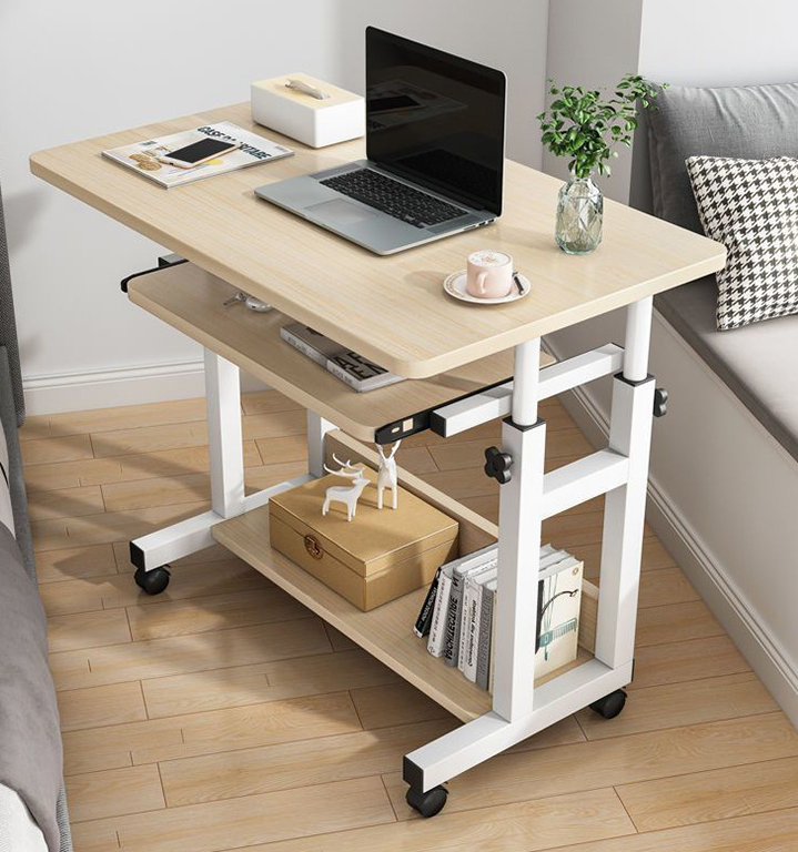 Adjustable Mobile Computer Desk with laptop, books, and other items in a room setting.
