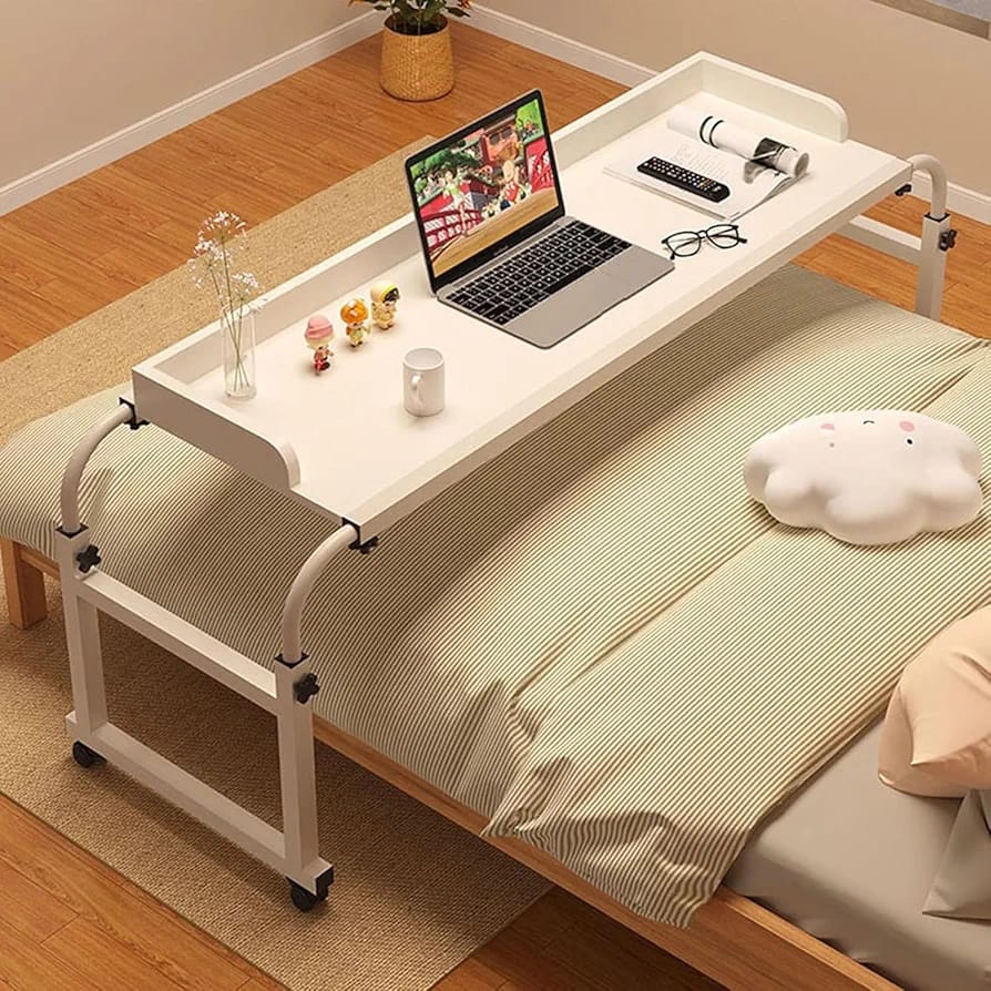 White Adjustable Overbed Table is Placed Above Bed.