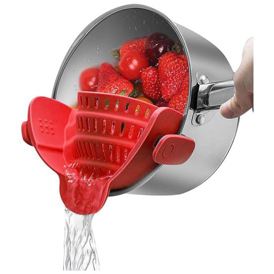 A Person is Straining Strawberry By Attaching Adjustable Silicone Pot Pan Bowl Strainer.