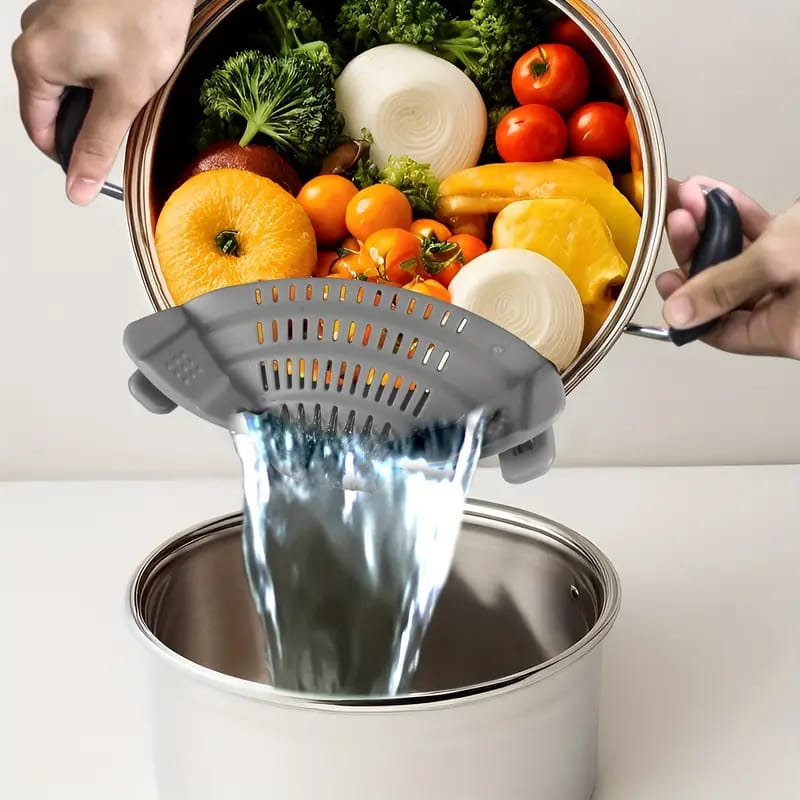 A Person is Straining Vegetables By Attaching Adjustable Silicone Pot Pan Bowl Strainer.