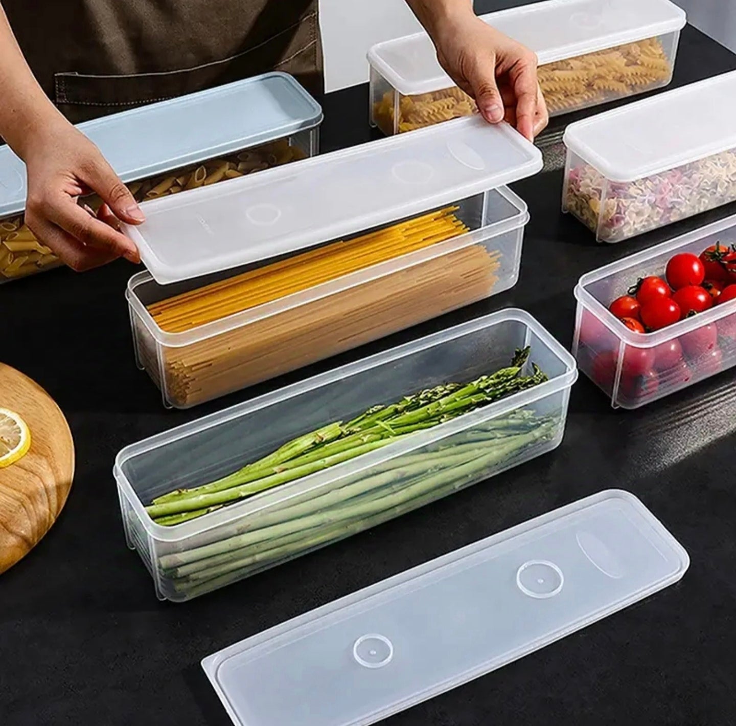 A Person is Storing Different Food Items in Airtight Rectangular Storage Box.