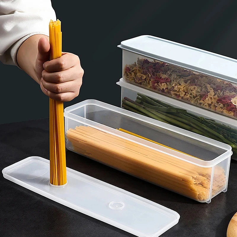 A Person is Storing Spaghetti in Airtight Rectangular Storage Box.