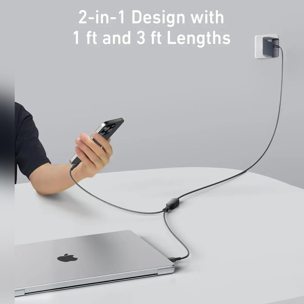 A Person is Charging Mobile Phone and his Laptop Using Anker 2-in-1 Cable.