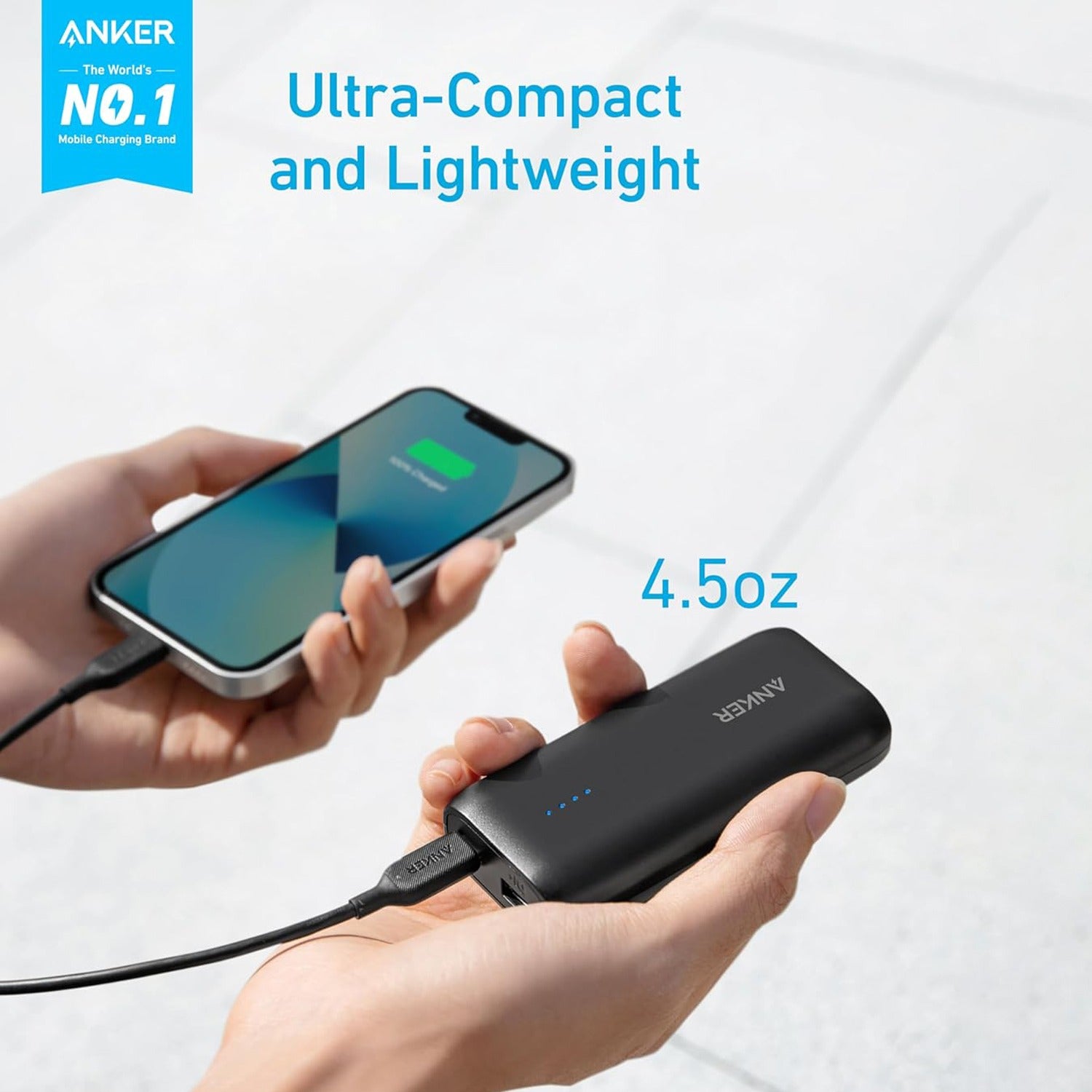 A Person is Holding Mobile Phone Connected to Anker 321 Power Bank (PowerCore 5K).