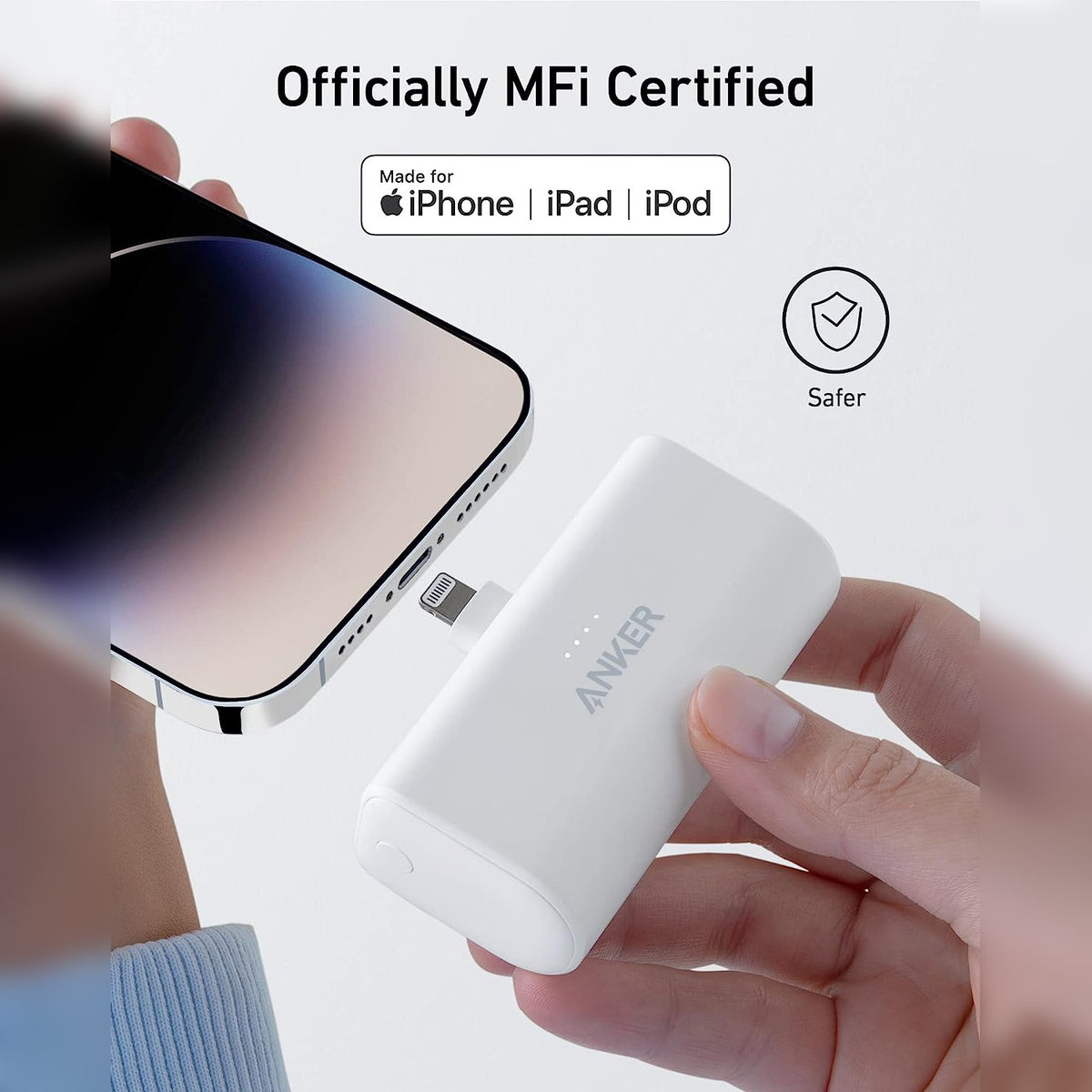 Someone is trying to plug in their mobile phone using the Anker Nano Power Bank