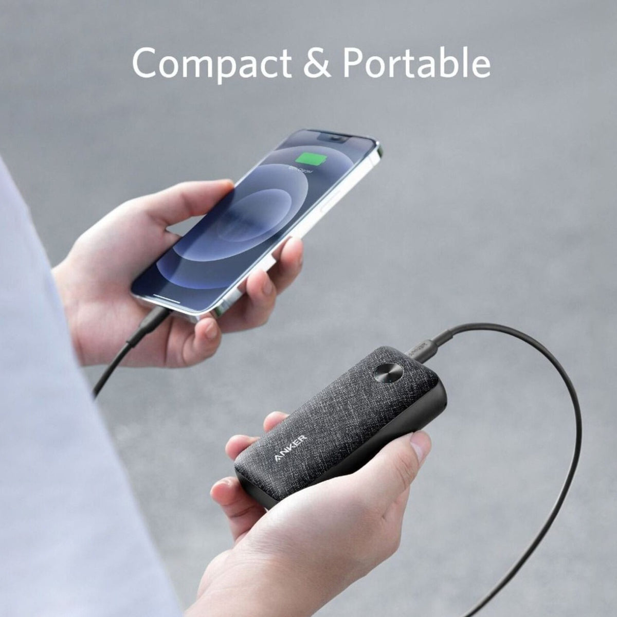 Someone charging the phone  using the Anker PowerCore Metro 10000mAh Fast Charging Power Bank