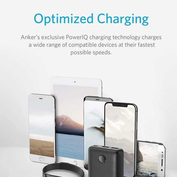 Anker PowerCore Select 10000mAh Portable Power Bank placed on the table next to mobile phones