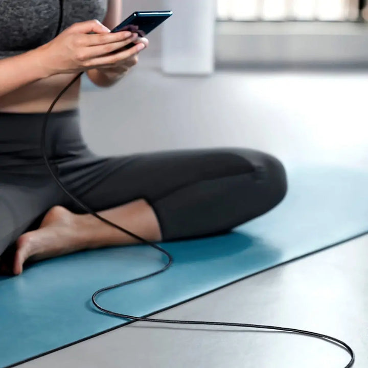 A Person is Using  Mobile Phone While Charging with Anker PowerLine Select+ USB-A to Lightning Cable.