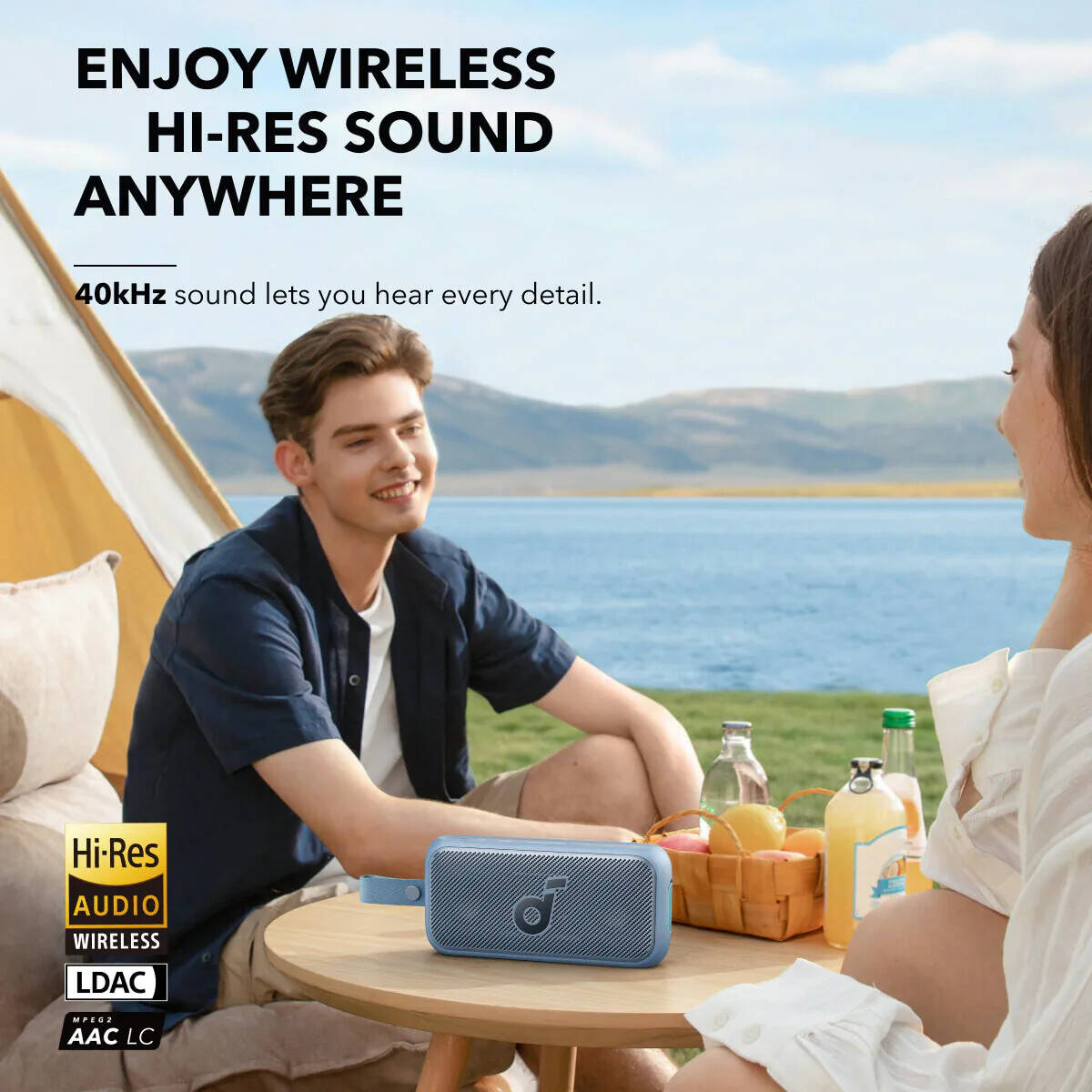 A Camping Couple is Enjoying with Anker Soundcore Motion 300 Portable Bluetooth Speaker.