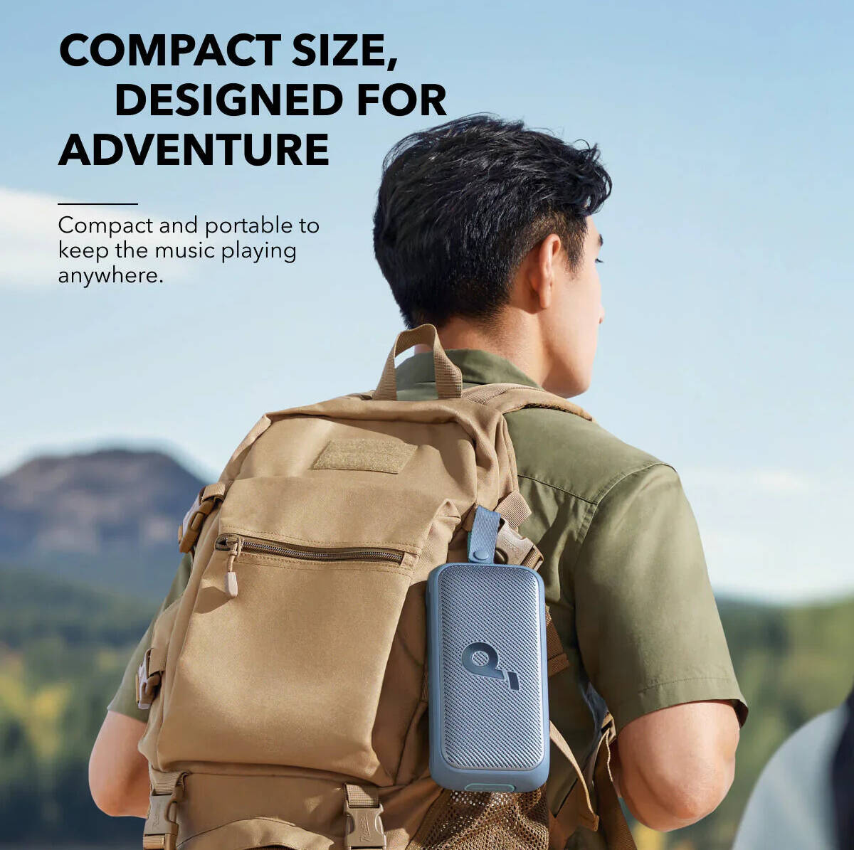 A Person is Attached Anker Soundcore Motion 300 Portable Bluetooth Speaker on his Bag.