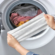 A Person is Holding Anti-Staining Laundry Paper.