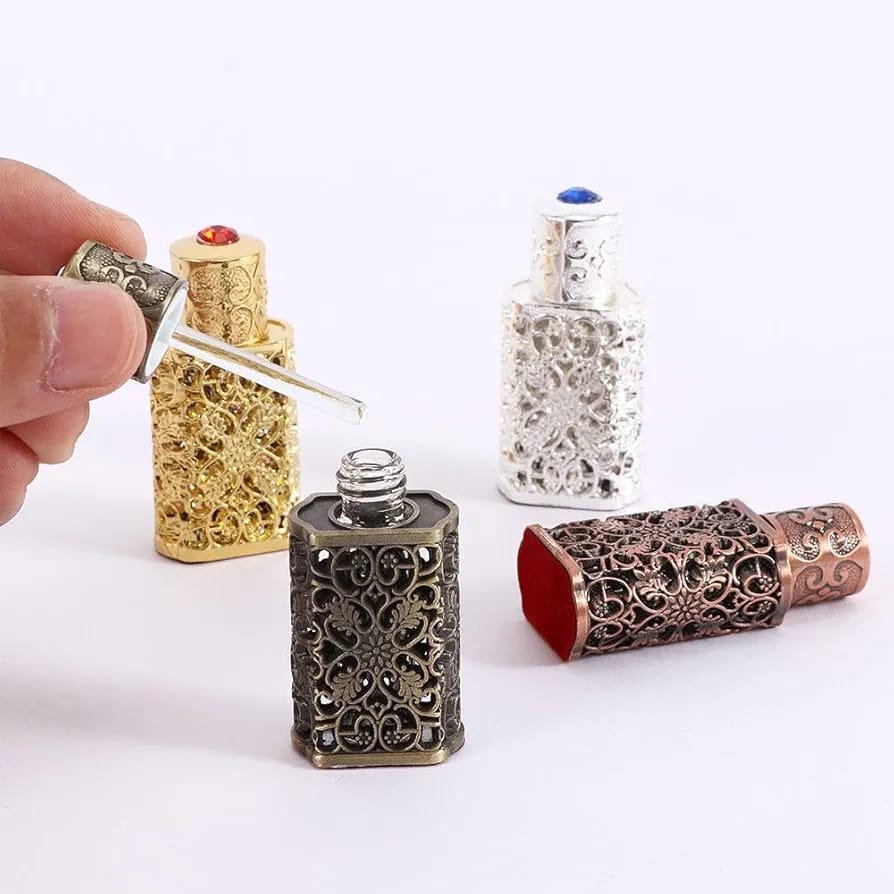 A Person is Taking from Antique Mini Perfume.