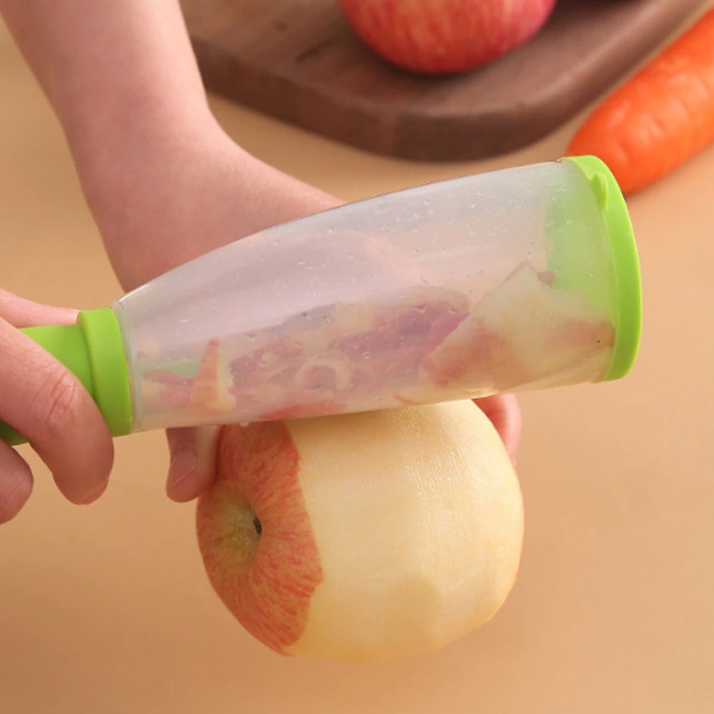 A Person Is Peeling Apple With Stainless Steel Peeler.