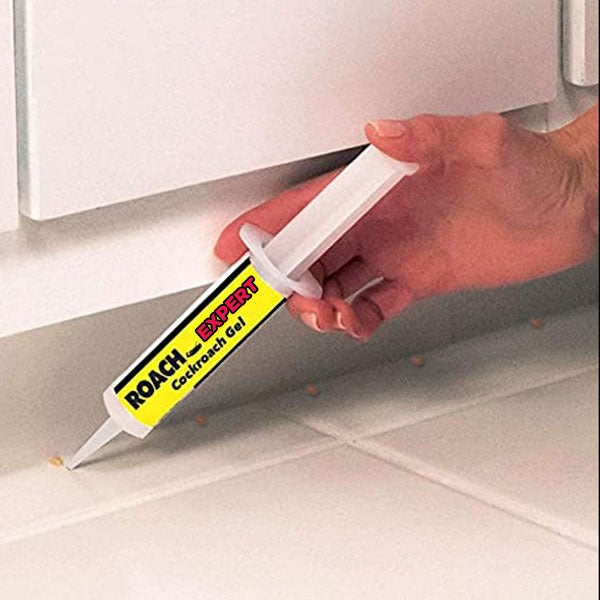 A Person is Applying Anti Cockroach Roach Expert Gel.
