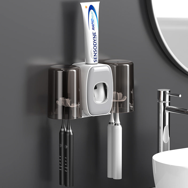 Automatic Toothpaste Dispenser With Brushes and Toothpaste Are Placed On it.