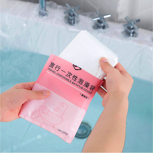 Someone taking the Disposable Bathtub Bag, portable clear disposable bathtub bathing cover film liner