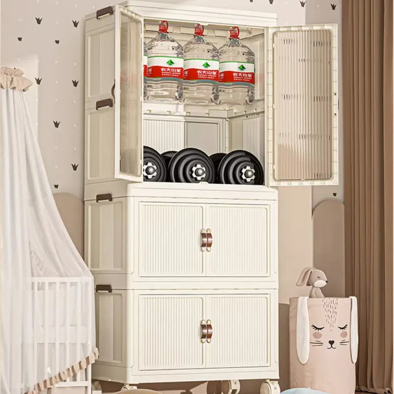 Portable folding storage cabinet with wheels placed on the floor in front of the wall with some things