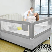 A Baby and Mother is Playing Inside a Bed Protected with Baby Bed Rail.