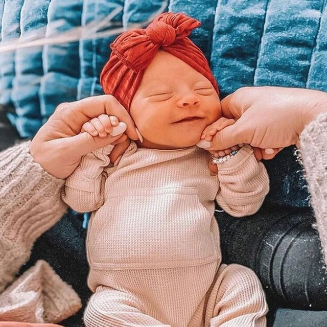 Baby Girl With Soft Baby Headband.