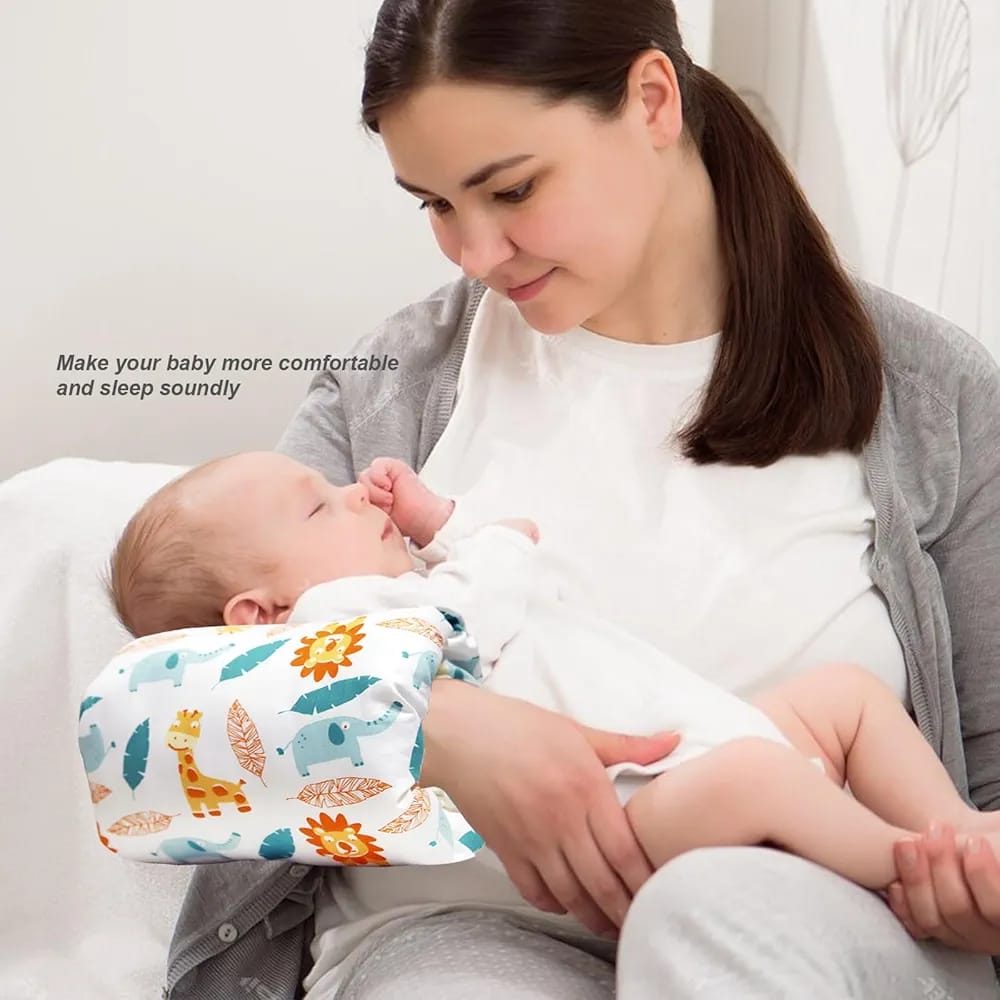 A Women is Holding Her Baby By Placing Nursing Arm Pillow On Her Hand.