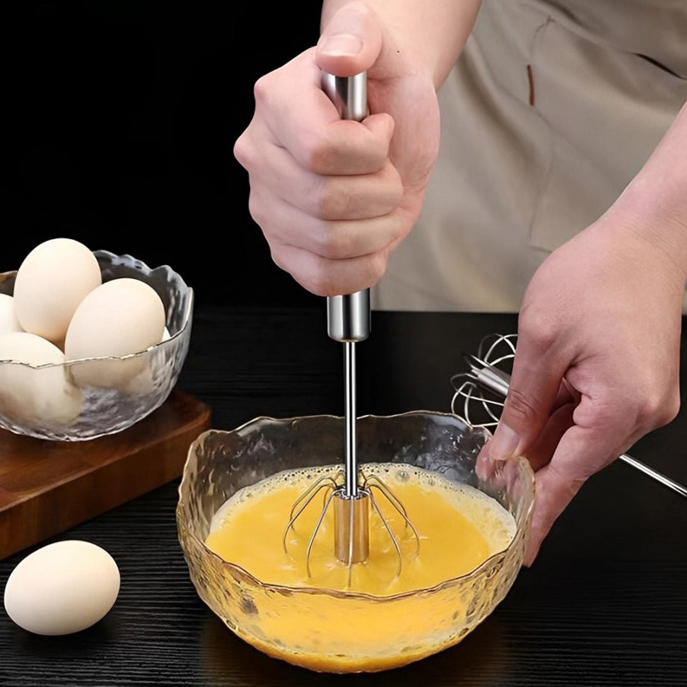 A Person is Beating Egg Using Egg Beater.