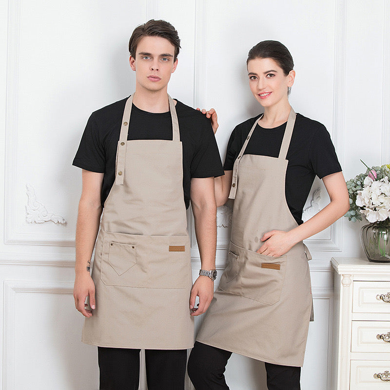 A Men and Women is Wearing Beige Unisex Adjustable Kitchen Chef Apron.