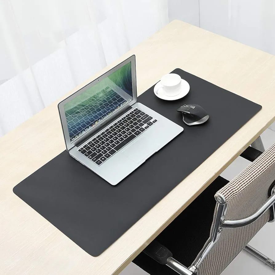 Laptop Is Placed On Large Black Laptop Desk Mouse Mat.