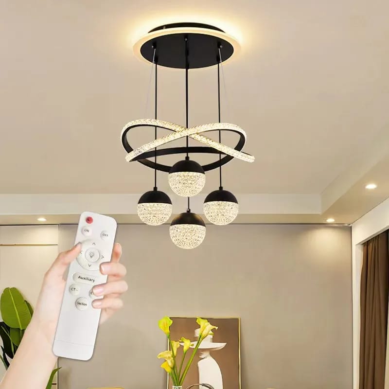 A Person is Controlling Modern Chandelier Pendant Indoor Lamp With Remote Control.