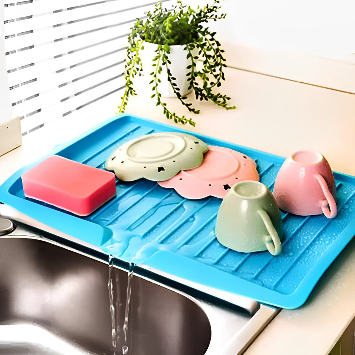 Utensils Are Placed On The Sink Dish Drainer Tray Rack.