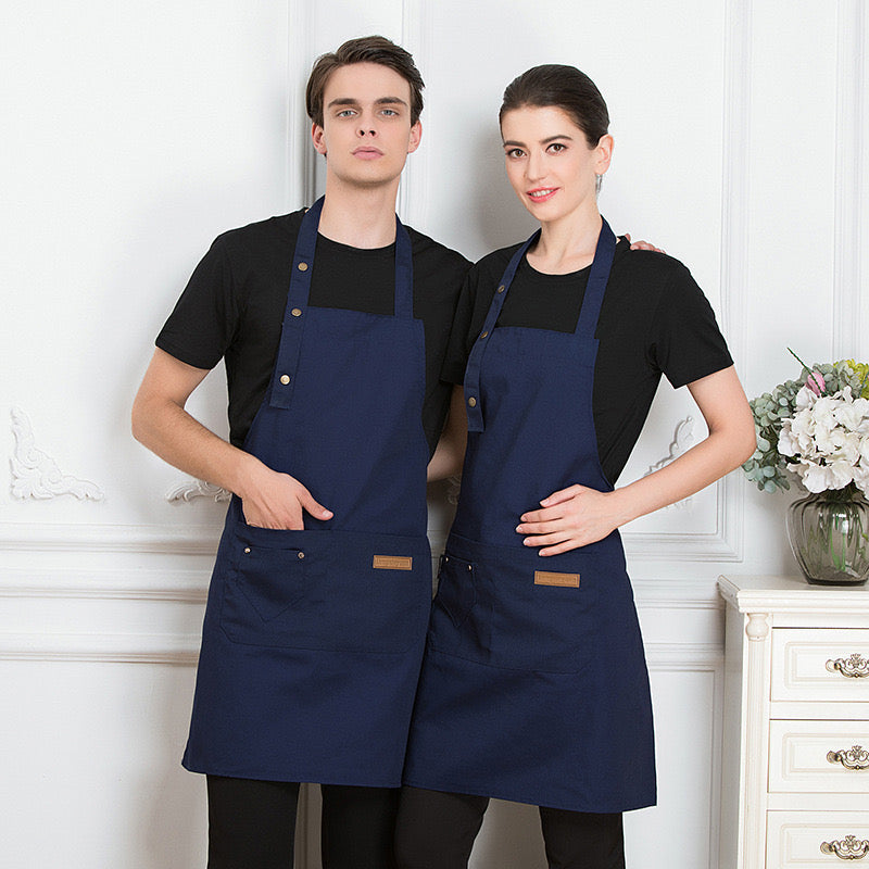 A Men and Women is Wearing Blue Unisex Adjustable Kitchen Chef Apron.