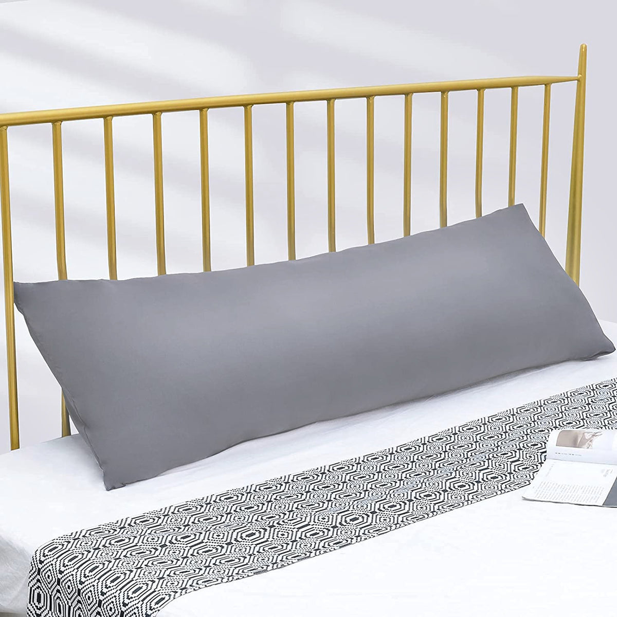 A Body Pillow is Kept on the Cot.