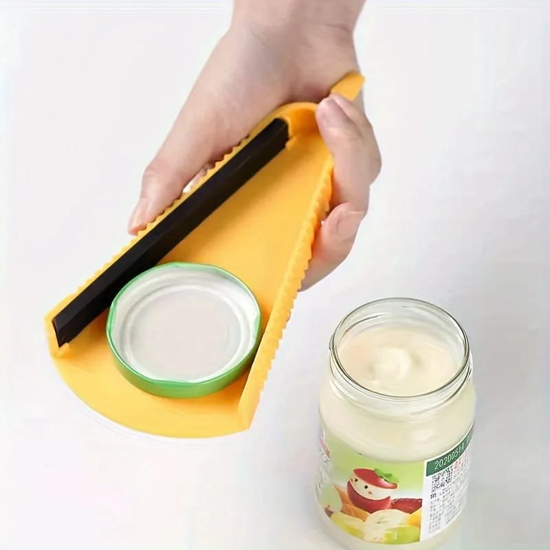 A Person is Opening The Lid Of a Bottle Using Bottle Can Opener.