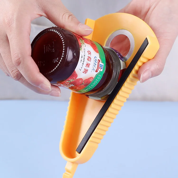 A Person is Opening The Lid Of a Bottle Using Bottle Can Opener.