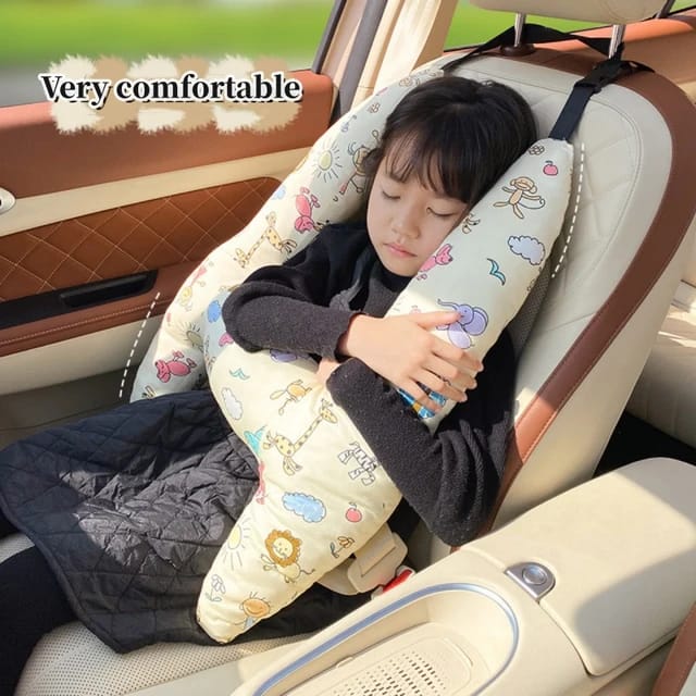 A child sleeping in a car with the assistance of a Car Seat Travel Pillow