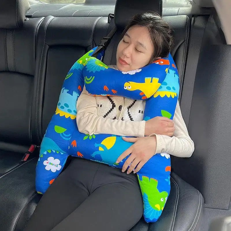 A girl sleeping with the help of a Car Seat Travel Pillow