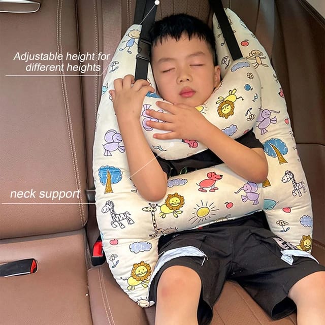 A child sleeping in a car with the assistance of a Car Seat Travel Pillow