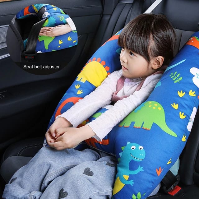 A child sitting in a car with the assistance of a Car Seat Travel Pillow