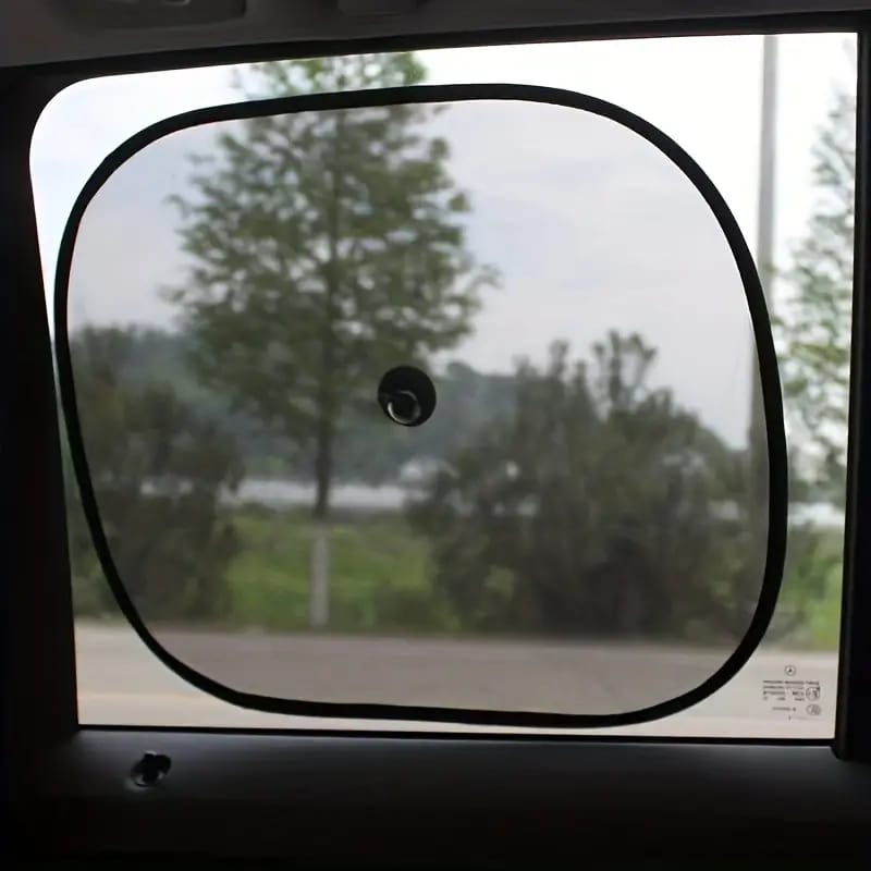 A Car Sun Shade is Fixed On Car Window.