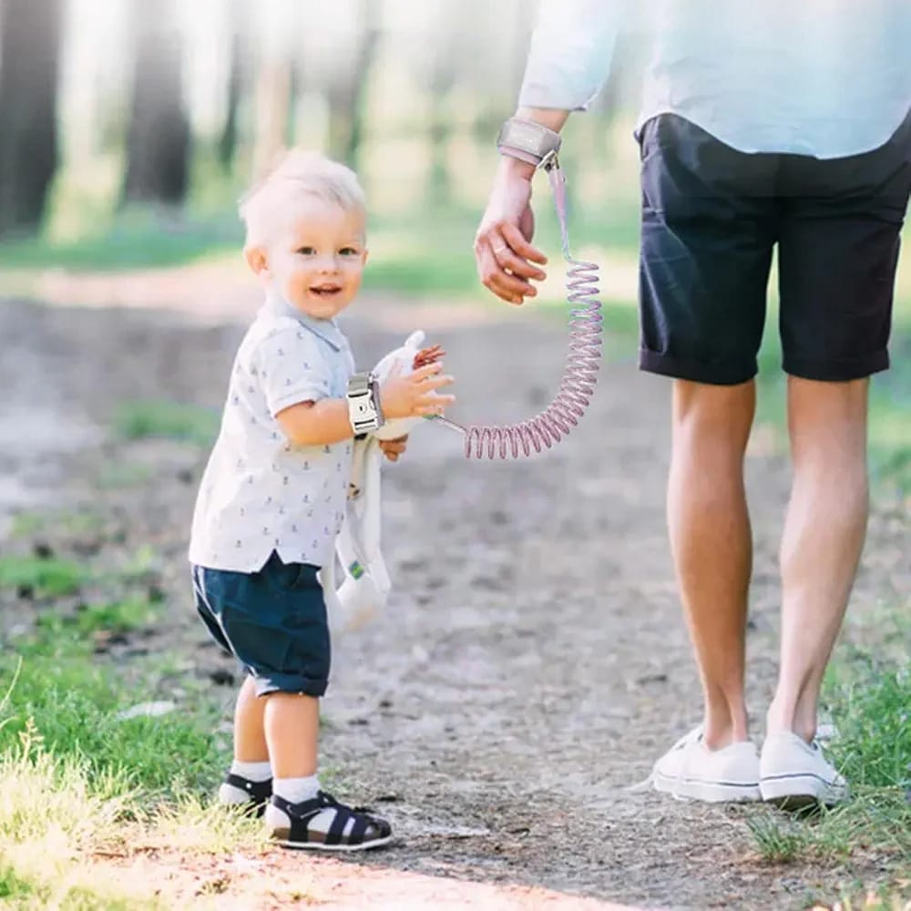 Hands Of Parent and Child Tied Using Child Safety Harness Leash.