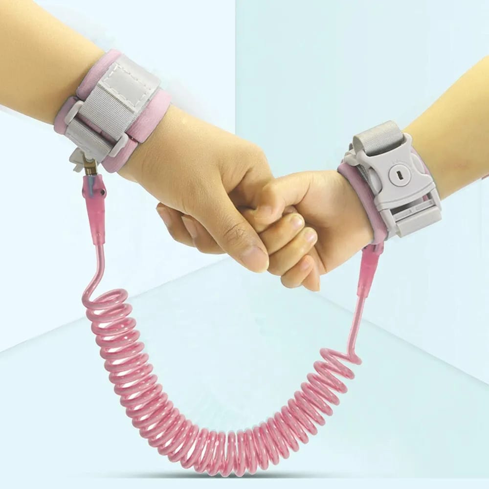 Hands Of Parent and Child Tied Using Child Safety Harness Leash.