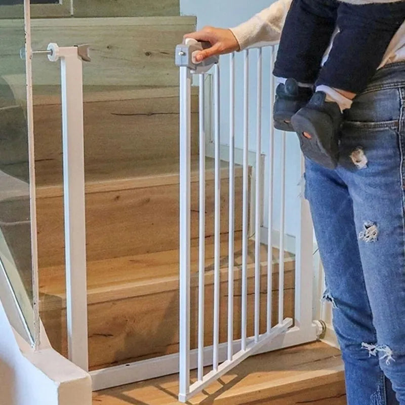 A person opening Children Safety Gate which is installed on a staircase 