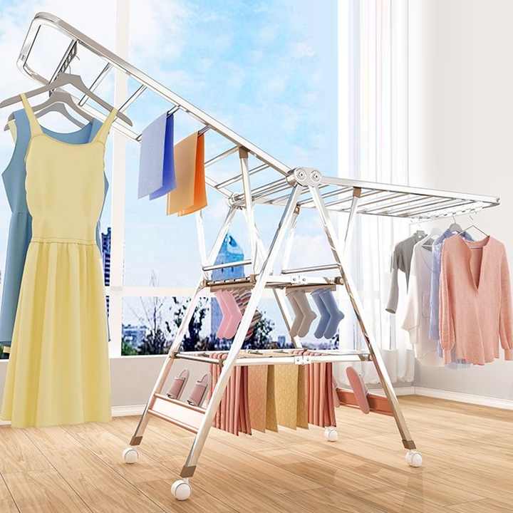 Cloth Drying Rack With Clothes are Hanged On it.