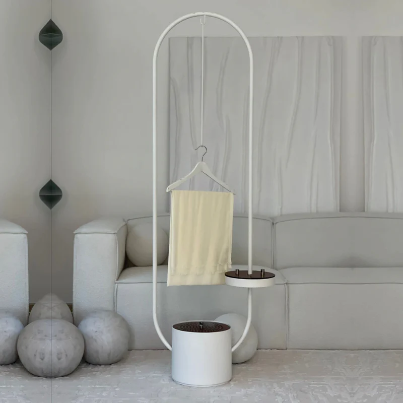 Cloth Incense Burner Stand is Placed in a Living area with a Hanging Clothes.