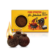 Coco Boom Coconut Shell Fire Starter with flames lit, shown in front of a yellow box labeled 'Fire Starter Coco Boomi'.