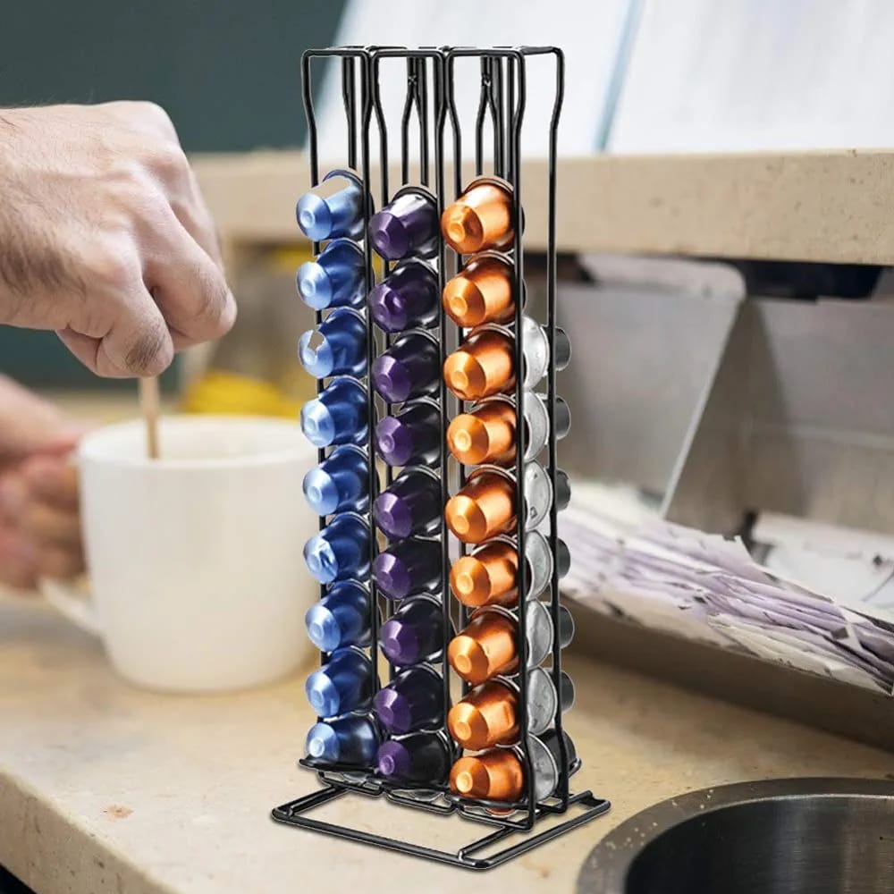 A Person Is Making Coffee By Taking Capsule From Coffee Pod Storage Rack Dispenser.