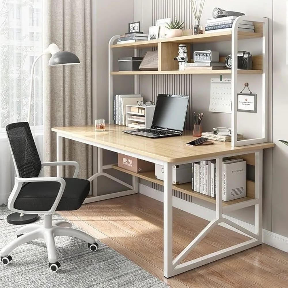 A Computer Desk is Organized with Laptop Books and Decor Items.