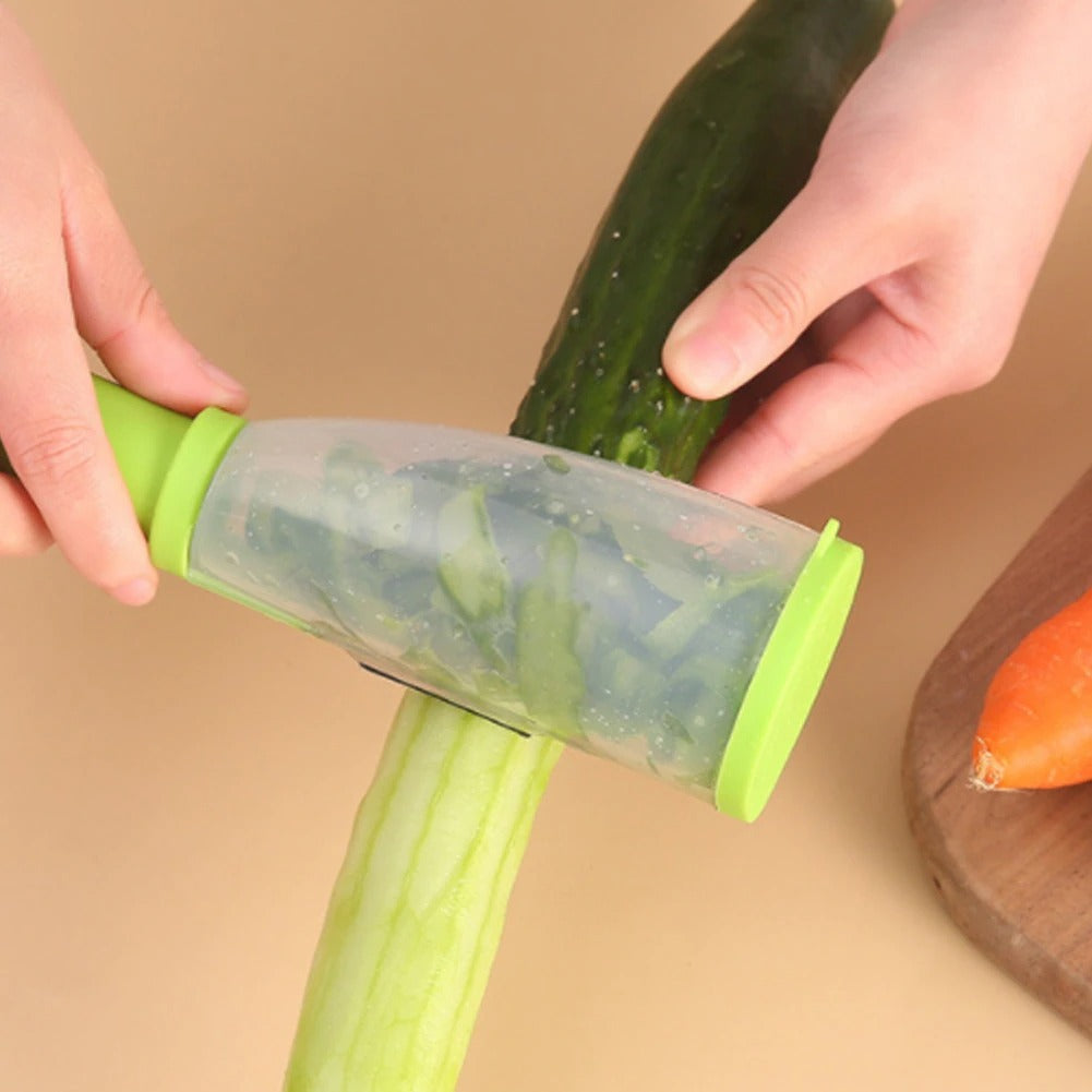 A Person Is Peeling Cucumber With Stainless Steel Peeler.